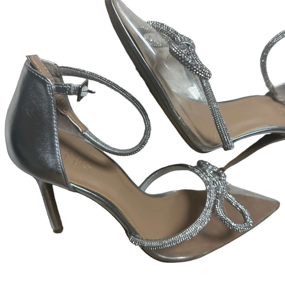 Inc Silver, see through and rhinestone bowed pump.  I’m good condition.